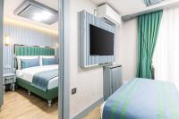 Postel nebo postele na pokoji v ubytování Santa Rio Gold Taxim Hotel