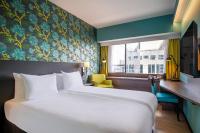 Ένα ή περισσότερα κρεβάτια σε δωμάτιο στο Thon Hotel Brussels City Centre