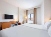Hotel Zentral Leónにあるベッド