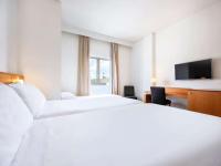 Hotel Zentral Leónにあるベッド