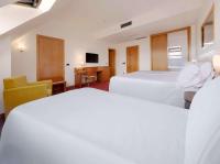 Hotel Zentral Leónにあるベッド