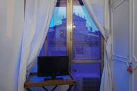 A television and/or entertainment centre at Cristina Rossi Bed&Breakfast
