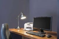 a desk with a computer monitor and a printer at Ramada by Wyndham Belfast in Belfast