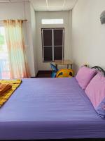 Postel nebo postele na pokoji v ubytování TAMONWAN HOUSE Koh Tao