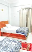 Postel nebo postele na pokoji v ubytování Niber Guest House