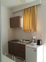 Kuchyň nebo kuchyňský kout v ubytování Fantasia Hotel Apartments