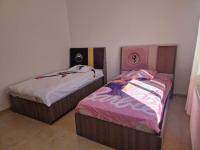 Postel nebo postele na pokoji v ubytování Appartement résidence al amra