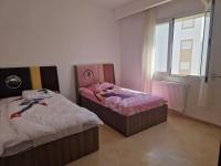 Postel nebo postele na pokoji v ubytování Appartement résidence al amra