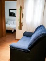 A bed or beds in a room at Apartamentos Day Madrid ILDEFONSO Centro Gran Via Sol Malasaña