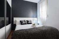 A bed or beds in a room at Apartamentos Day Madrid ILDEFONSO Centro Gran Via Sol Malasaña