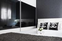 A bed or beds in a room at Apartamentos Day Madrid ILDEFONSO Centro Gran Via Sol Malasaña