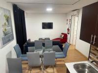 A television and/or entertainment centre at Apartamentos Day Madrid SANTO DOMINGO Centro Gran Via Sol Malasaña