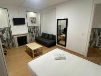 A television and/or entertainment centre at Apartamentos Day Madrid SANTO DOMINGO Centro Gran Via Sol Malasaña