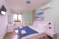 Posteľ alebo postele v izbe v ubytovaní Holiday Home Luce