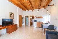 Televízia a/alebo spoločenská miestnosť v ubytovaní Holiday Home Luce