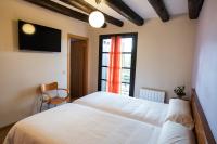 Cama o camas de una habitación en Camping & Bungalows Ligüerre de Cinca