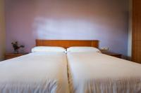 Cama o camas de una habitación en Camping & Bungalows Ligüerre de Cinca