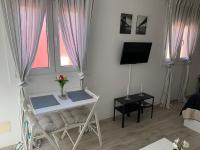 Televízia a/alebo spoločenská miestnosť v ubytovaní Mar&Mar, apartamento con solárium y piscina