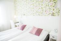 Postel nebo postele na pokoji v ubytování Nynäsgården Hotell & Konferens