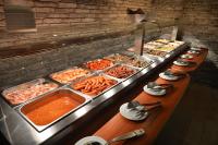 a buffet line with many different types of food at Wilson Palace by LOFT in Bratislava