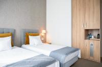 Łóżko lub łóżka w pokoju w obiekcie Hotel Arkadia Jelcz-Laskowice