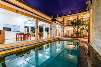 an indoor swimming pool in a house with a house at Balian Paradise Hotel in Selemadeg