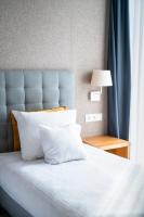 Łóżko lub łóżka w pokoju w obiekcie Hotel Arkadia Jelcz-Laskowice