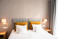 Łóżko lub łóżka w pokoju w obiekcie Hotel Arkadia Jelcz-Laskowice