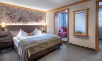 Łóżko lub łóżka w pokoju w obiekcie Hotel Königgut