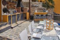 A restaurant or other place to eat at Villa Charma with private pool and Air conditioning close to sitges in peaceful location