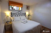 A bed or beds in a room at Villa Charma with private pool and Air conditioning close to sitges in peaceful location