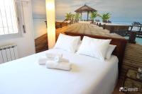 A bed or beds in a room at Villa Charma with private pool and Air conditioning close to sitges in peaceful location