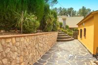 A garden outside Villa Charma with private pool and Air conditioning close to sitges in peaceful location