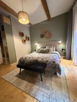 Posteľ alebo postele v izbe v ubytovaní le J&J Appartement spacieux climatisé en centre ville