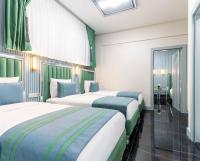 Postel nebo postele na pokoji v ubytování Santa Rio Gold Taxim Hotel
