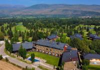 an aerial view of a resort with a large building at Hotel Fontanals Golf in Soriguerola