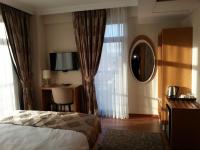 Postel nebo postele na pokoji v ubytování Gevher Hotel