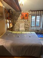 Łóżko lub łóżka w pokoju w obiekcie La maison de Brigitte aux petites avaizes