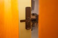 an open door with a black handle on a door at Flat Casa Mauá in Rio de Janeiro