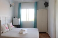 Postel nebo postele na pokoji v ubytování Hotel Casa Día y Noche
