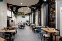 a dining room with wooden tables and chairs at Hotel Convictus Cracovia for business & travellers in Kraków
