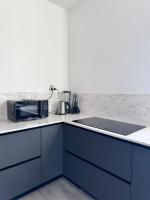 Kuchyňa alebo kuchynka v ubytovaní Loft épuré avec parking privé.