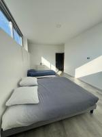 Posteľ alebo postele v izbe v ubytovaní Loft épuré avec parking privé.