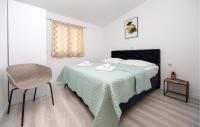 Postel nebo postele na pokoji v ubytování Holiday Apartment Makarska 3