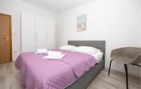 Postel nebo postele na pokoji v ubytování Holiday Apartment Makarska 3