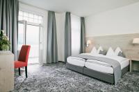 Postel nebo postele na pokoji v ubytování Hotel Restaurant Bellevue au Lac