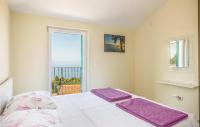 Postel nebo postele na pokoji v ubytování Holiday Home Gornji Tucepi 36