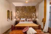 Postel nebo postele na pokoji v ubytování Archontiko Fiamegou Hotel&Spa