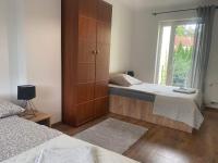 Postel nebo postele na pokoji v ubytování Komandorska Apartments