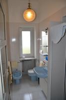 a bathroom with a sink and a toilet and a window at Hotel Villa Ruscello in Baveno
